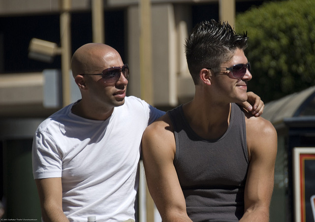 A gay couple watching a parade