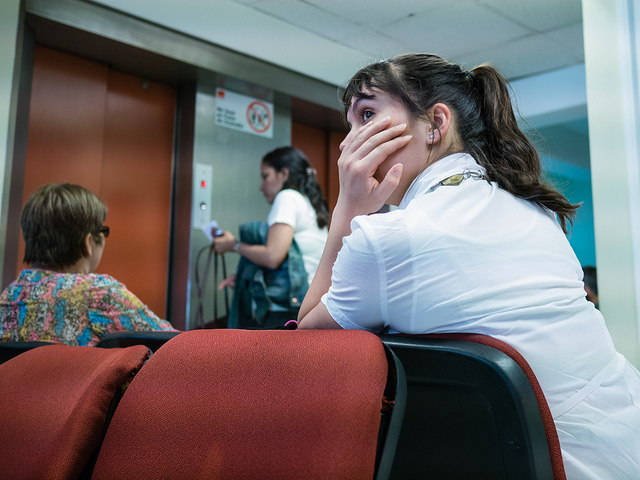 A woman waiting for a doctor in the hospital waiting room