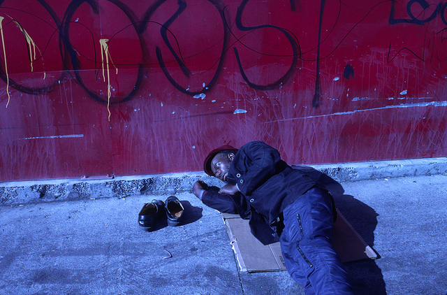 A homeless man sleeping on the streets of Los Angeles